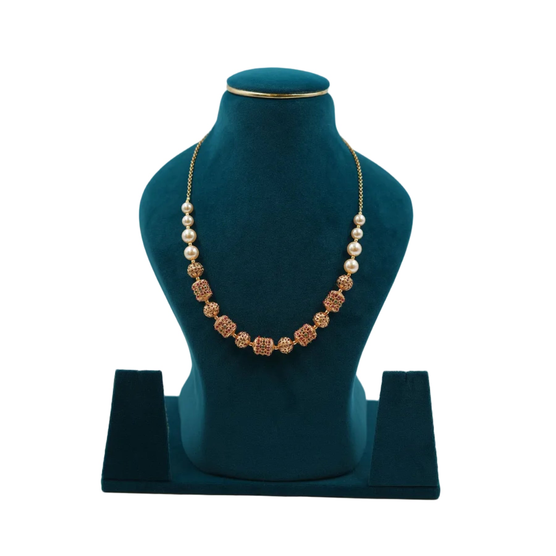 Handcrafted Lalithambike 1-gram gold beaded necklace with intricate ruby-toned filigree work and cream pearl accents on a teal jewelry bust.
