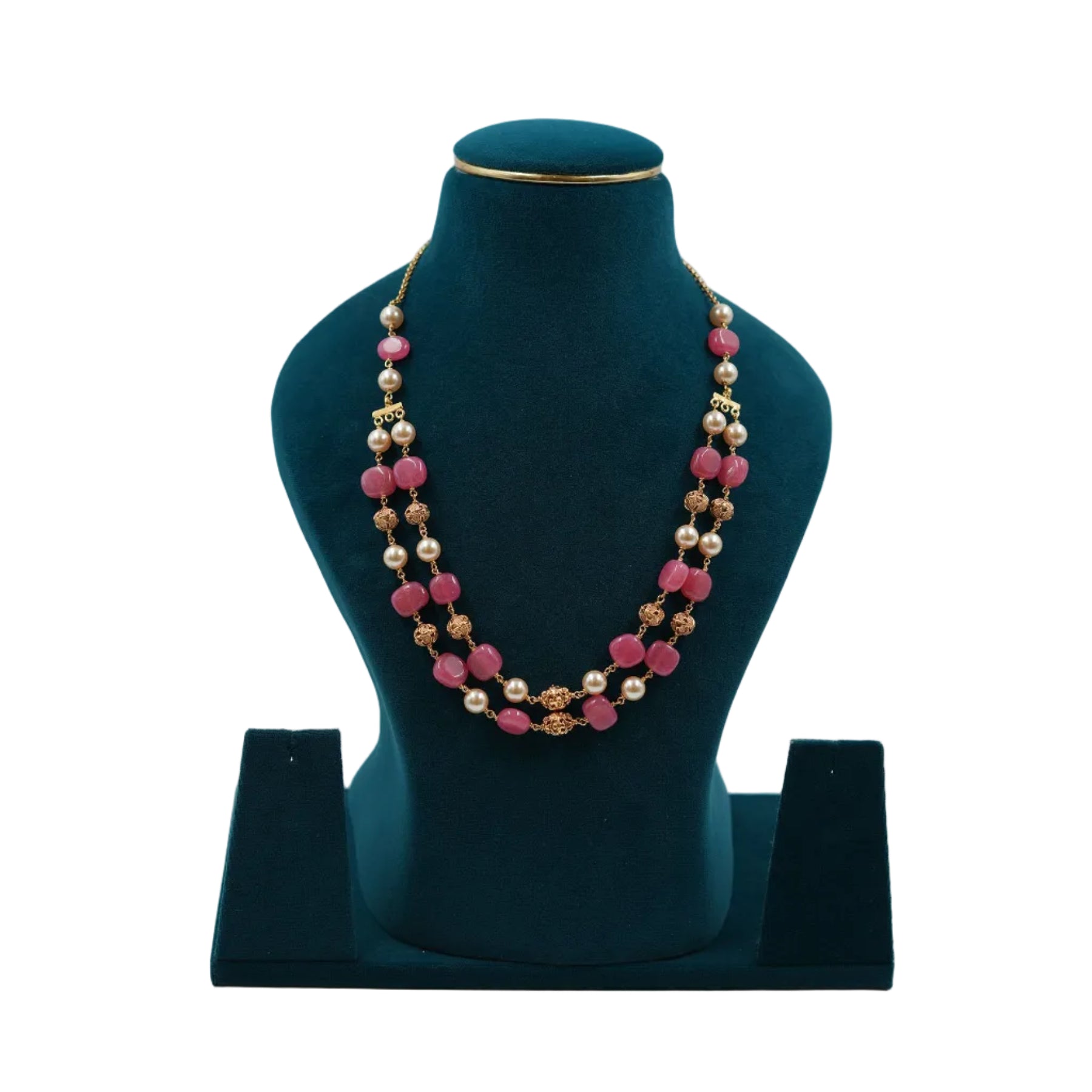 Lalithambike traditional two-strand necklace featuring vibrant pink square beads, cream pearls, and 1-gram gold filigree spacers on a teal jewelry bust.
