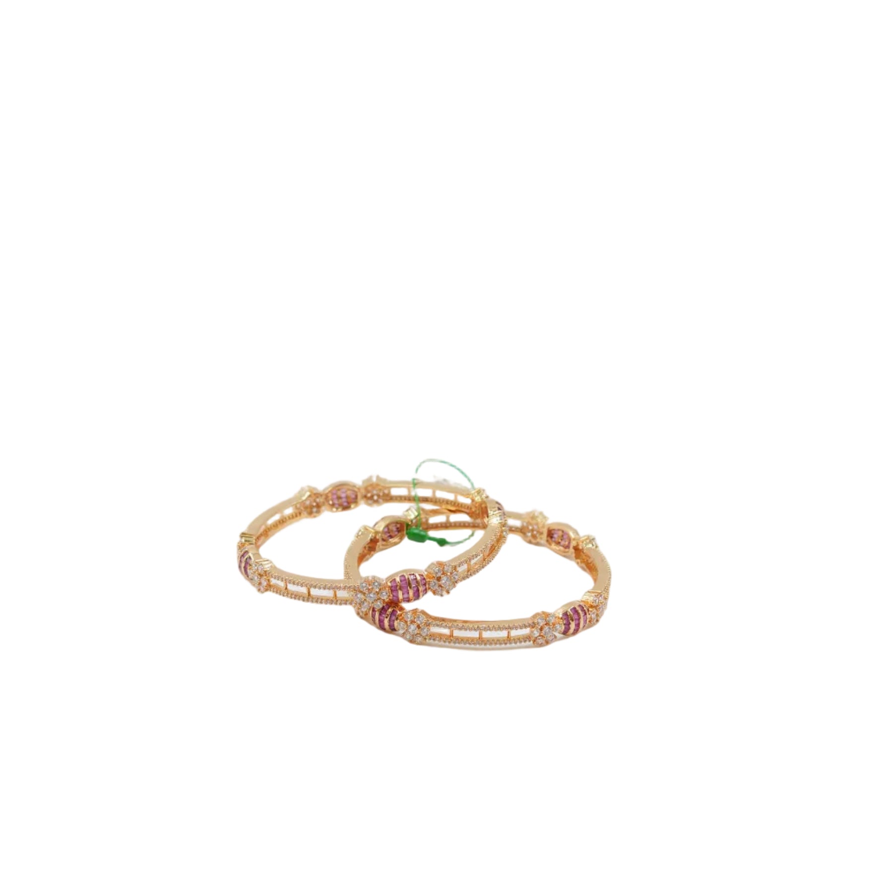 Premium pair of Lalithambike 1-gram gold bangles featuring ruby-toned stones and white crystal accents in a handcrafted open-work design.