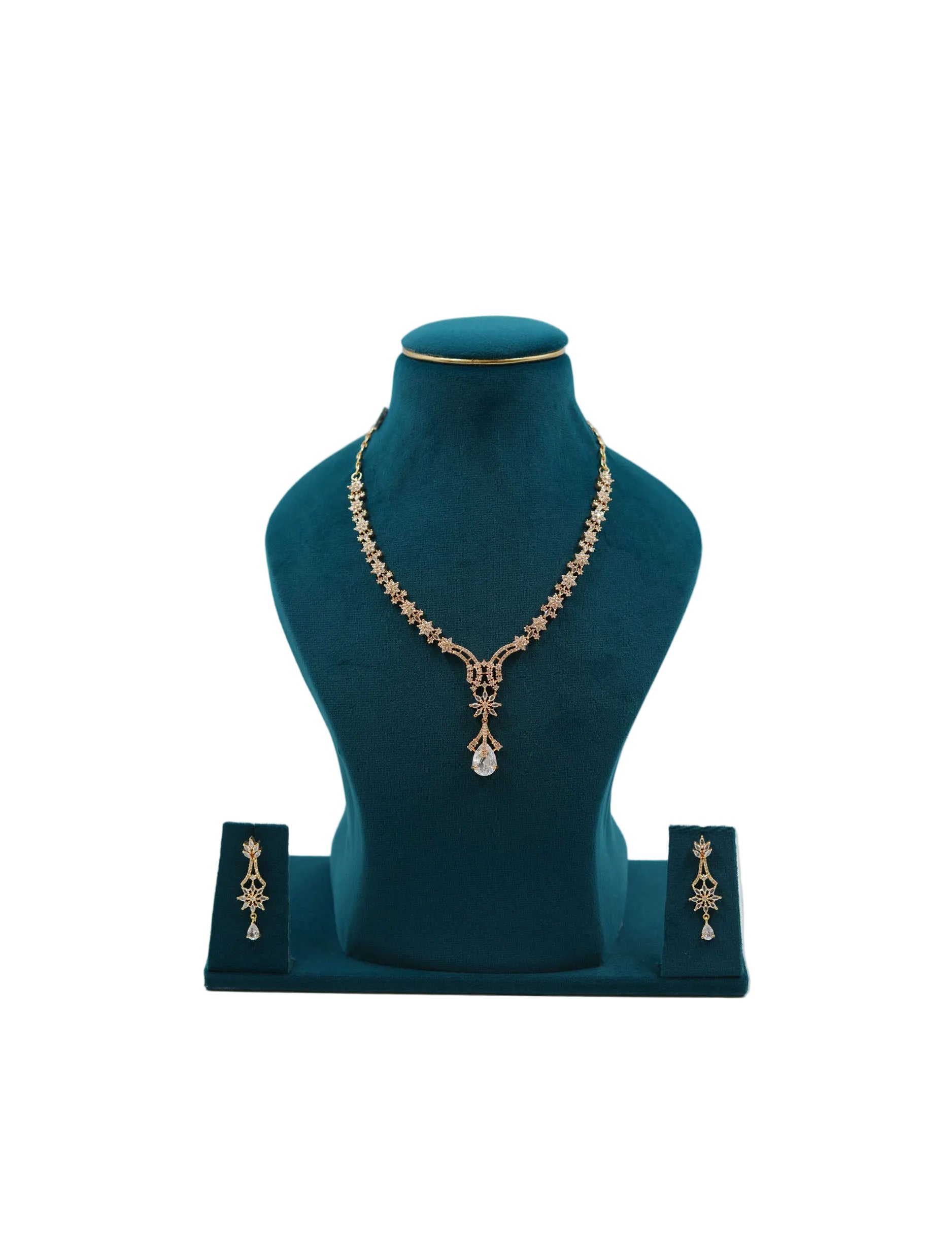 Lalithambike 1-gram gold star-motif necklace featuring a large crystal teardrop pendant and matching long-drop earrings on a teal display.