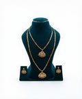 Lalithambike 1-gram gold jewelry combo set featuring a traditional choker, long haram necklace with fan-shaped pendants, and matching earrings on a teal display.