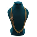 Traditional Lalithambike 1-gram gold seven-strand layered chain necklace featuring an intricate side brooch pendant, displayed on a premium teal jewelry bust.