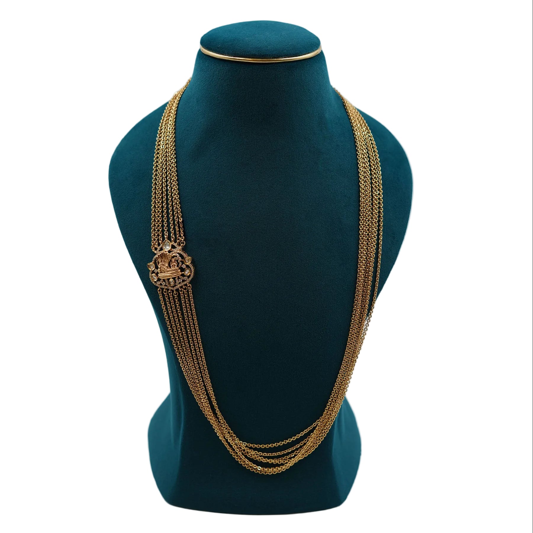 Traditional Lalithambike 1-gram gold seven-strand layered chain necklace featuring an intricate side brooch pendant, displayed on a premium teal jewelry bust.