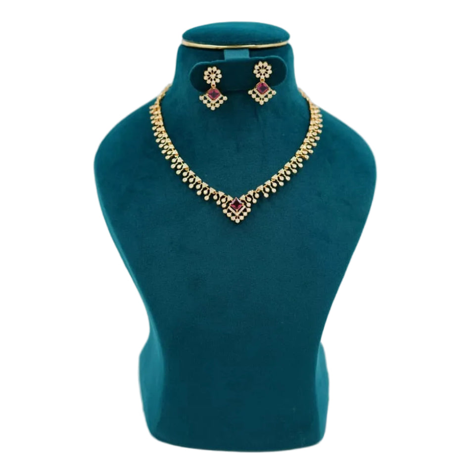 Traditional 1-gram gold necklace and earring set featuring a vibrant blue square central pendant, intricate dangling gold charm droplets, and matching earrings with maroon stone accents—exclusive Lalithambike Malleshwaram collection.