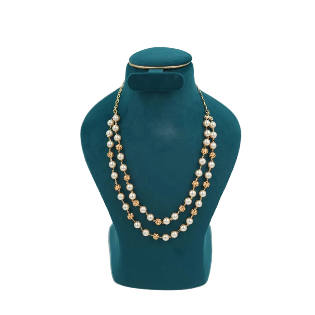 1 gram gold plated double layer pearl necklace with gold beads on teal jewelry display stand.